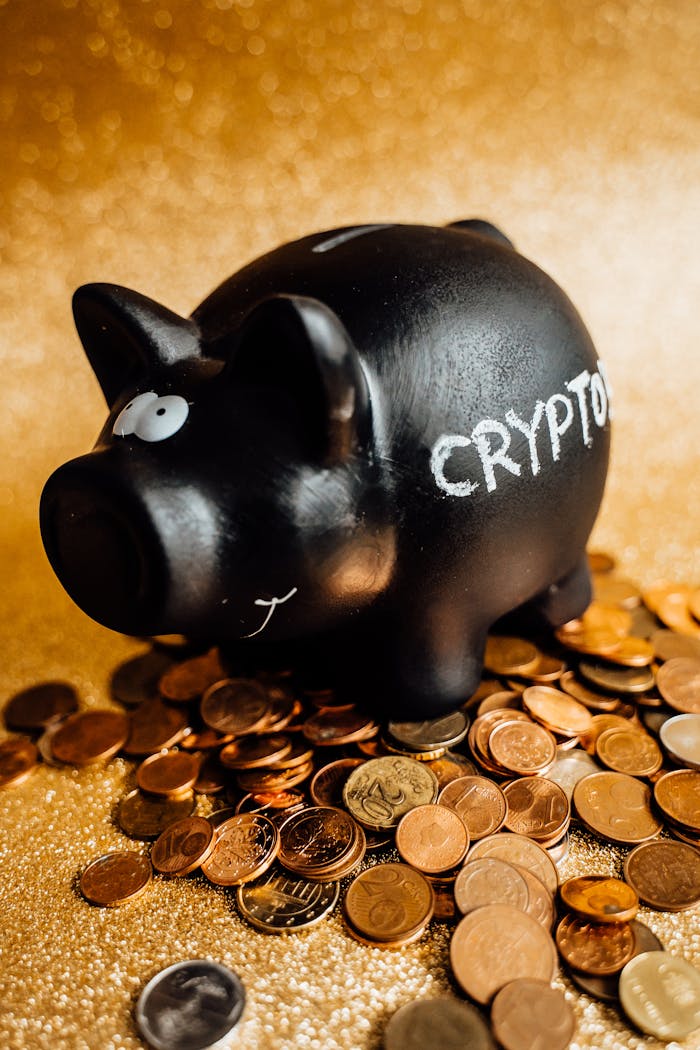 Mastering the First Impression: Your intriguing post title goes here A black piggy bank labeled 'CRYPTO' surrounded by various coins on a gold background.